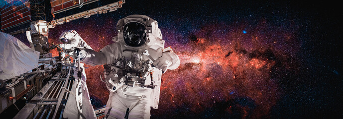 Astronaut spaceman do spacewalk while working for space station in outer space . Astronaut wear full spacesuit for space operation . Elements of this image furnished by NASA space astronaut photos. © InfiniteFlow