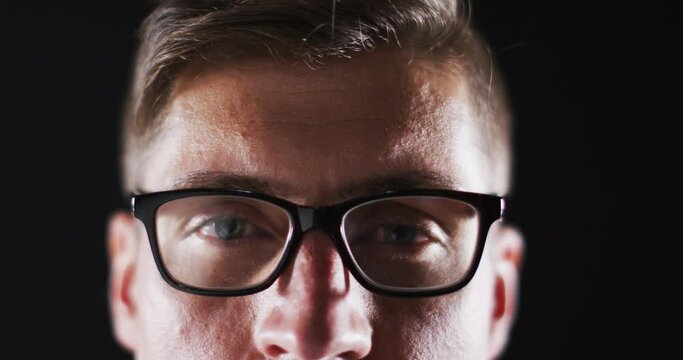 Close up portrait of face of caucasian man wearing glasses with focus on eyes