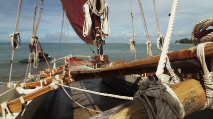 Eye-level view of Polynesian double-hulled Catamaran deck and stern in Oahu, Hawaii - Medium close up shot