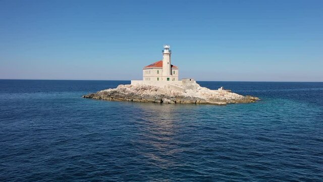 Aerial View of Mulo Lighthouse on Small Island in Croatian Adriatic Sea Water on Sunny Summer Day, Drone Shot