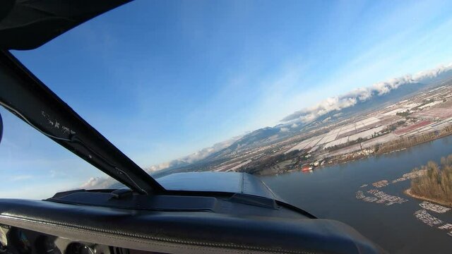 PA-28 Plane Flight From Pitt Meadows To Downtown Vancouver, BC, Canada. View Of City Landscape Surrounded By Water. -  POV Shot