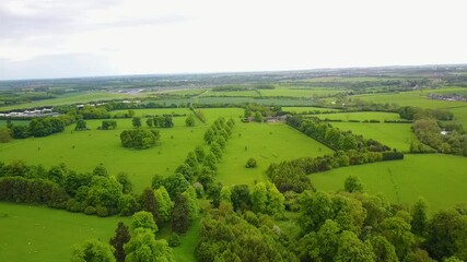 Flight over British countryside with green and yellow fields