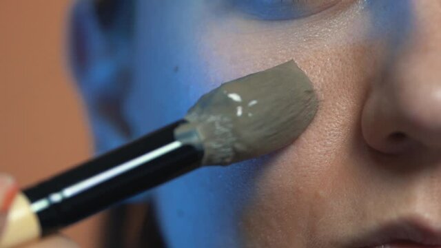 Applying a clay face mask. Full HD 60FPS colored