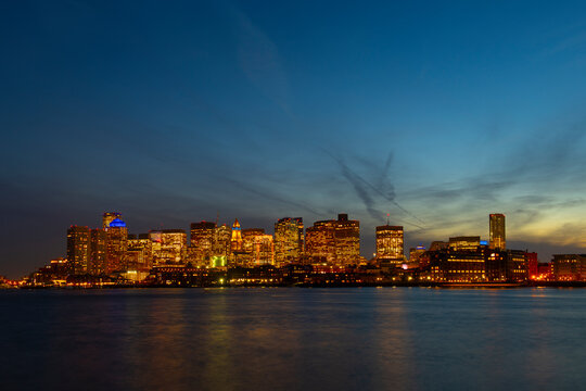 Boston City Skyscrapers, Custom House and Boston Waterfront at night from East Boston, Boston, Massachusetts MA, USA.