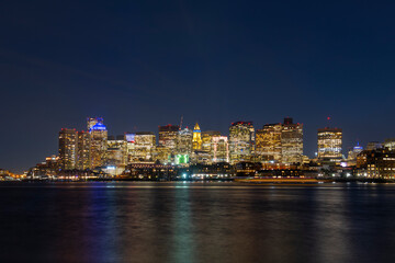 Fototapeta na wymiar Boston City Skyscrapers, Custom House and Boston Waterfront at night from East Boston, Boston, Massachusetts MA, USA.