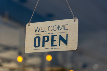 Open sign broad through the glass of door in cafe ready to service., Business service and food concept.