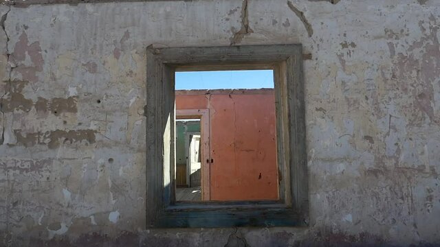 Ghost old nitrate town office ruined window in Chacabuco, Chile