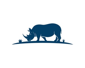 Rhinoceros silhouette with eating grass