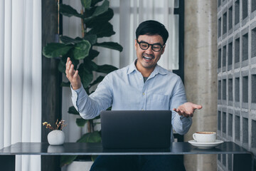 asian man work using computer hand typing laptop keyboard contact us.student study learning education online.adult professional people chatting search at office.concept for technology device business