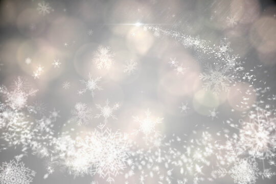Abstract illustration of christmas snowflakes and spots of bokeh lights against grey background