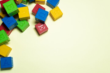 COLORFUL CUBE TOYS IN A YELLOW BACKGROUND