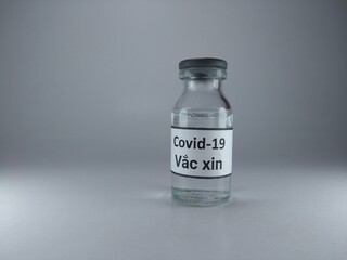 Covid 19 vaccine written in Vietnamese language on a vaccine bottle 