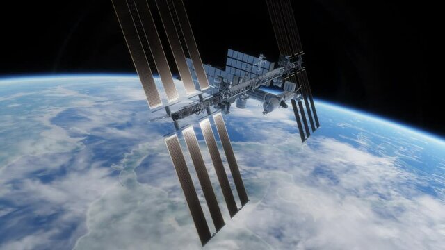 The International Space Station orbiting above the Earth, shining bright and giving off beautiful sun flares
