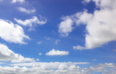 Naklejka na ściany i meble Tropical fluffy white cloudy over blue sky on sunny day.