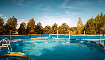 Circular Family Pool on Wooded Backyard