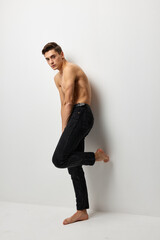 handsome man black pants nude body attractiveness self-confidence