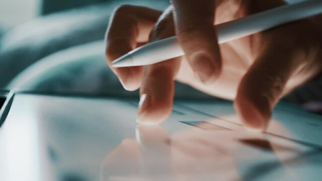 closeup female hand draws on a graphics tablet