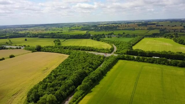 Flight over British countryside with green and yellow fields