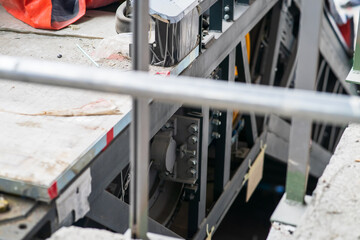 Construction of the escalator. Big gear of conveyor mechanism.