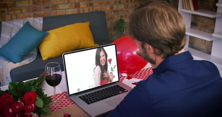 Caucasian couple on a valentines date video call man waving to smiling woman holding red rose on lap - Powered by Adobe