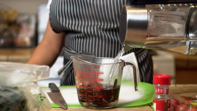 Soaking dried ancho chilies in preparation for using them in a vegan recipe 