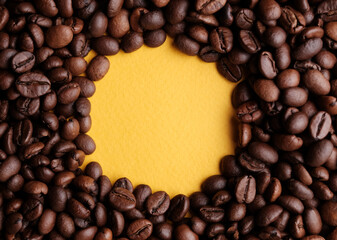 Coffee beans frames at yellow  background. Copy space  for your text