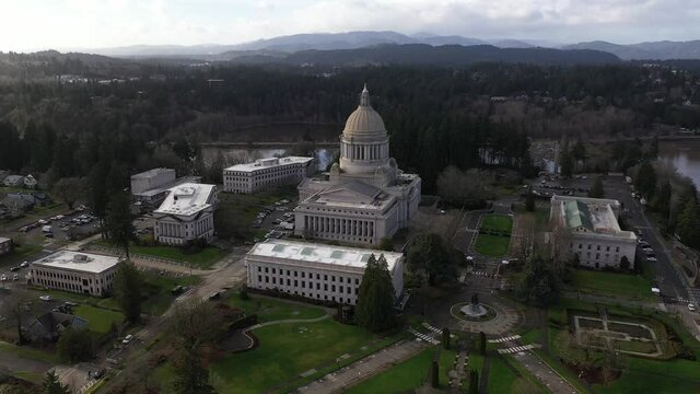 Aerial - drone footage of the capitol building and surrounding campus in Olympia, Washington.