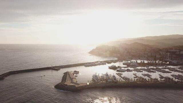 Imperia Porto Maurizio sunset aerial view over the port harbor city in Liguria, Mediterranean sea. Imperia Borgo Prino.