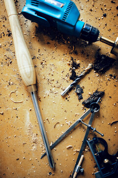 Overhead View Of Work Tools On Table At Workshop