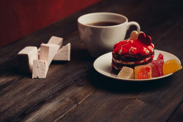 red round cake on a plate sweets candy dessert snack cup of tea
