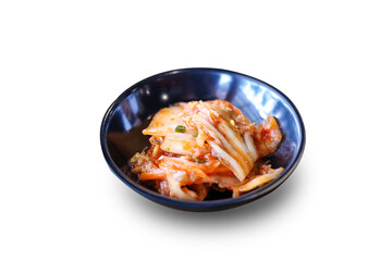 Kimchi in black bowl isolate on white background with clipping path.