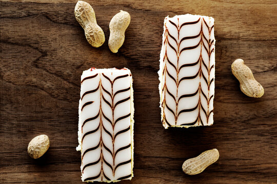 Overhead view of pastries and peanuts on table