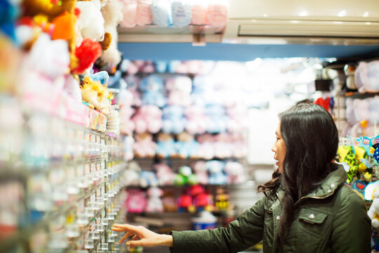 Woman buying toys at toy store