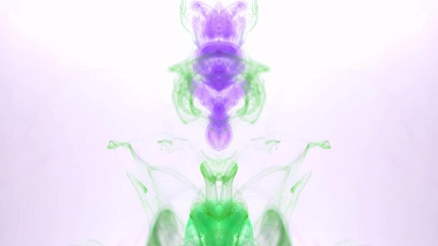 Violet-green ink in water. White background