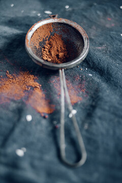 Close-up of cocoa powder in flour sifter