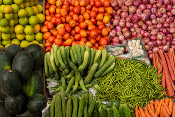 Top view of Indian fruit and vegetable vendors selling their product to locals in a local markets setup in India, Goa