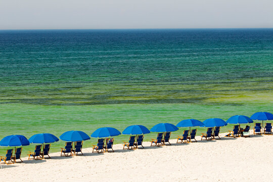 Deck chairs and parasols at beach