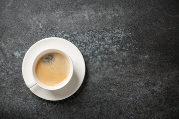 Cup of coffee on black background