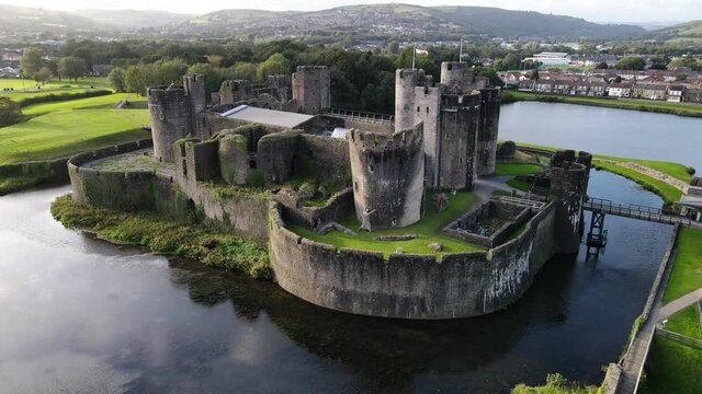 Aerial panoramic view of Caerphilly Castle and town, Southern Wales, UK