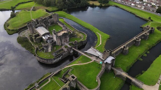 Caerphilly Castle lake and stone wall elaborate defense system aerial view