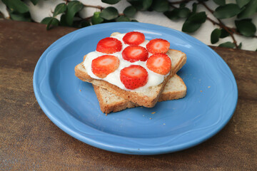 toast with whipped cream and strawberry topping