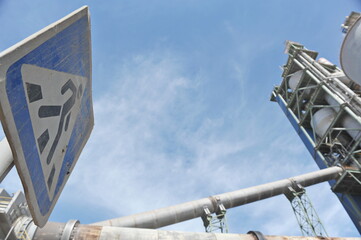 Zhambyl region, Kazakhstan - 05.15.2013 : Sign pedestrian crossing between the sectors of the cement plant