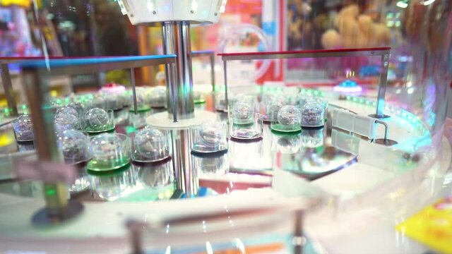 Arcade Machine Spinning With Toys Inside For Prize At An Arcade House In Japan. - close up