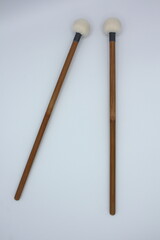 Timpani mallets on a white background.
