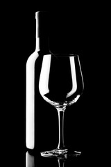 red wine bottle and wine glass isolated on black background