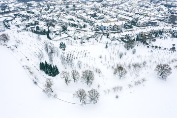 Fototapeta na wymiar residential houses covered with snow at winter season. belarusian suburb at wintertime. aerial view