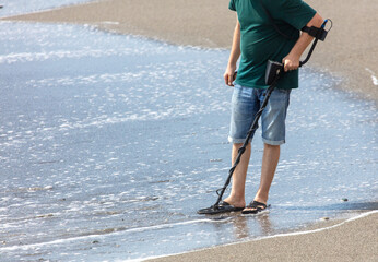 A man with a metal detector