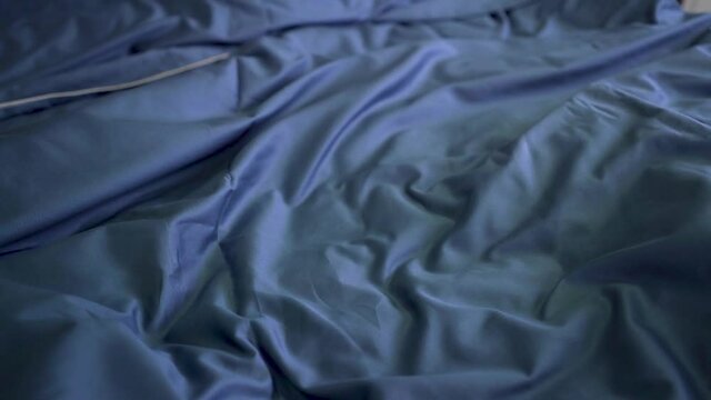 Blue bed linen on the bed in the bedroom