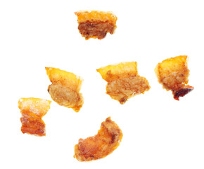 Fried lard cracklings on a white plate.