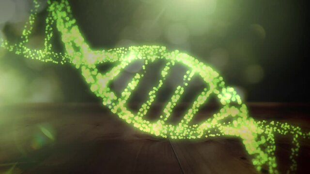 Animation of 3d green glowing dna strand spinning over green background